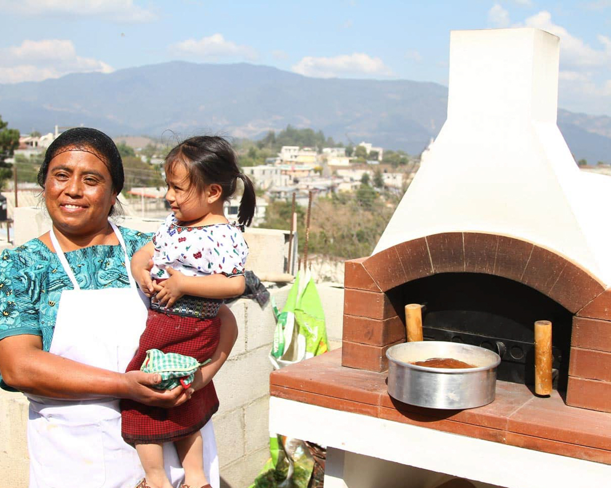 new-life-after-tragedy-miriam-child-oven Miriam stands with her daughter in front of the oven that kick-started her baking business.