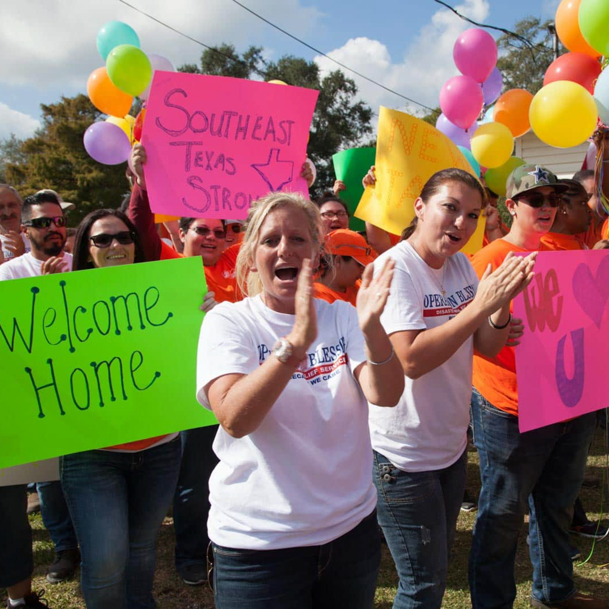 volunteer-amy-extreme-blessing Dedicated volunteer Amy claps as the Operation Blessing team reveals an Extreme Blessing to a worthy recipient.