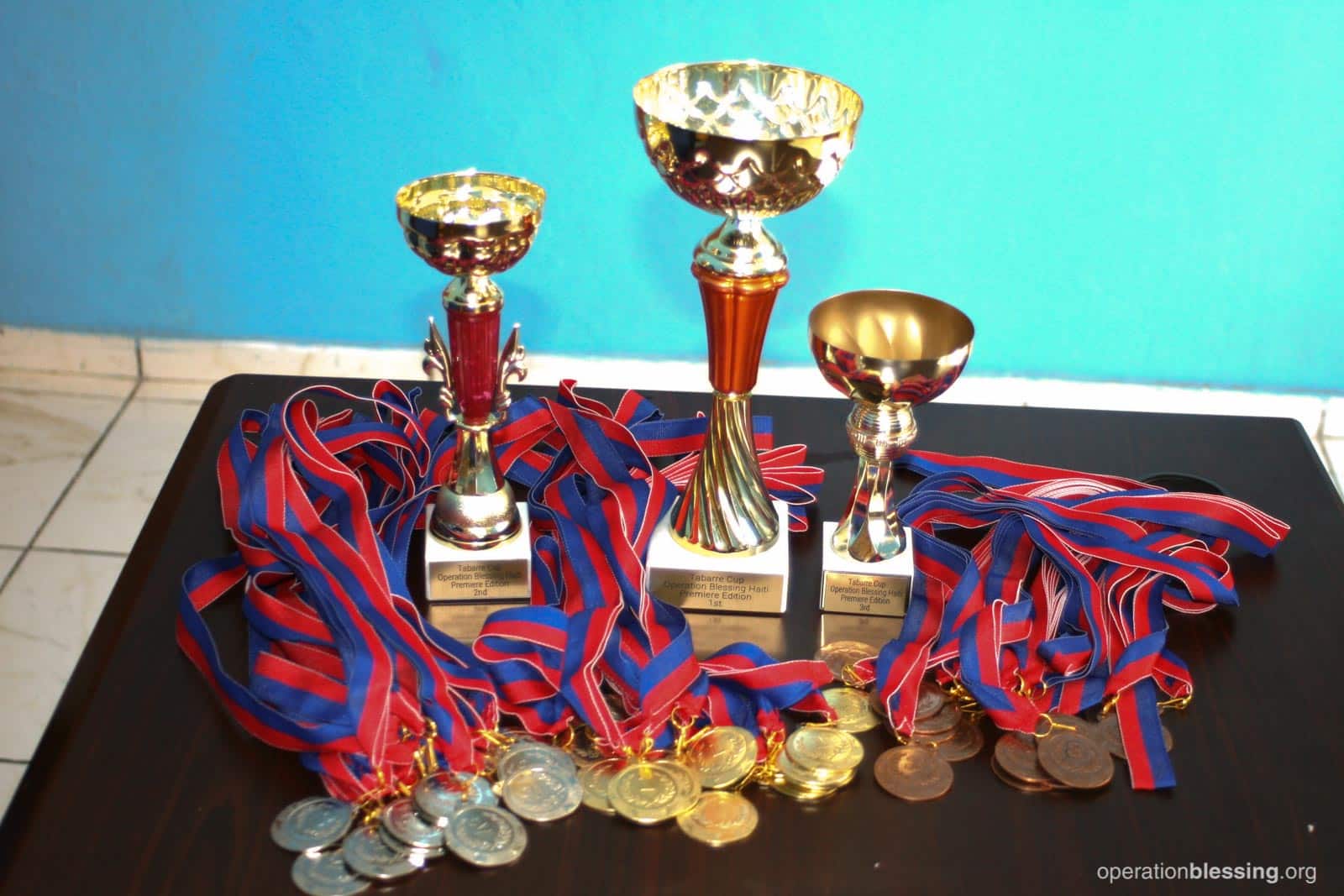 baseball-life-skills-haiti-trophies Baseball tournament trophies and medals.