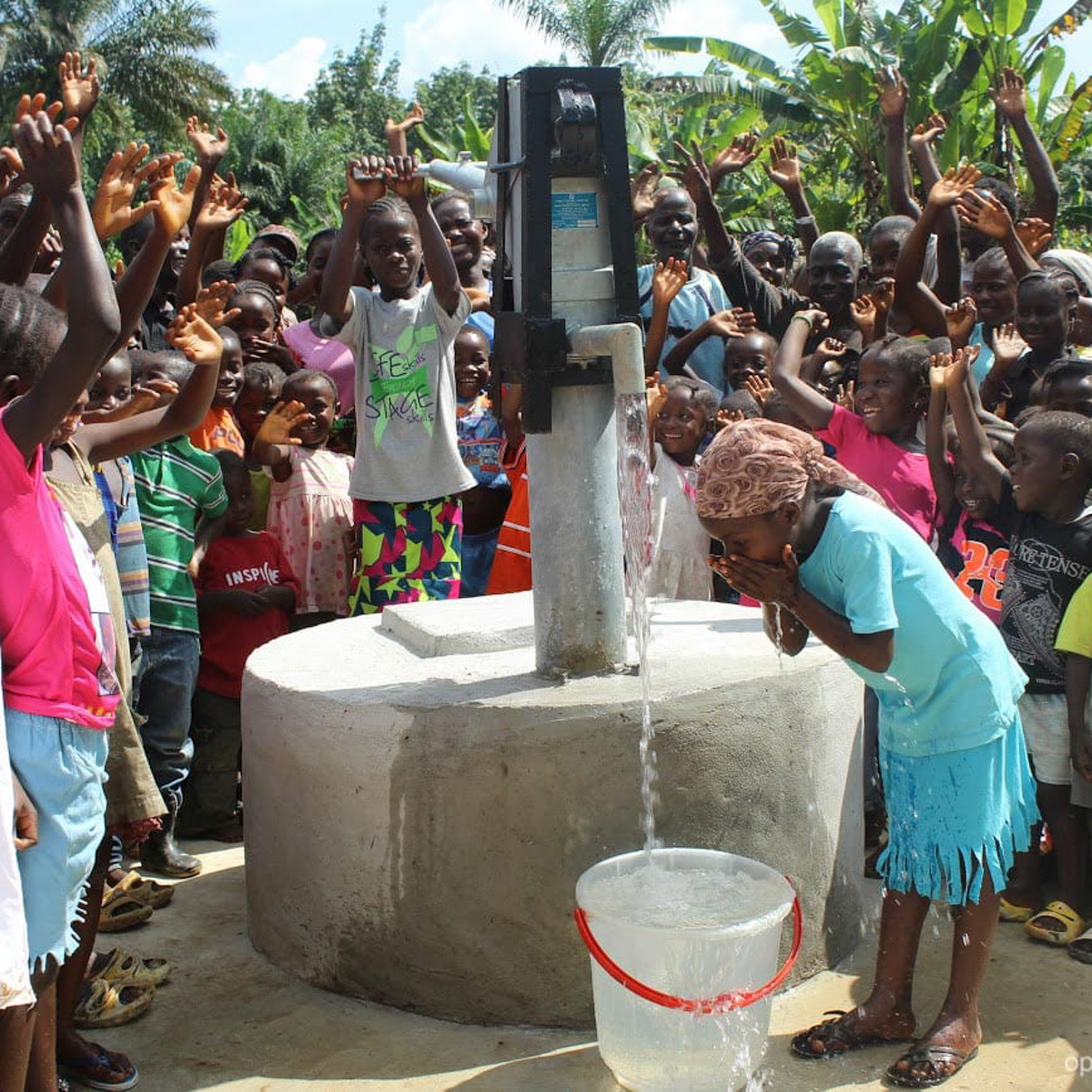 water-wells-liberia-girl-drink A young Liberian girl drinks deep from one of the new wells OBI built in her area.